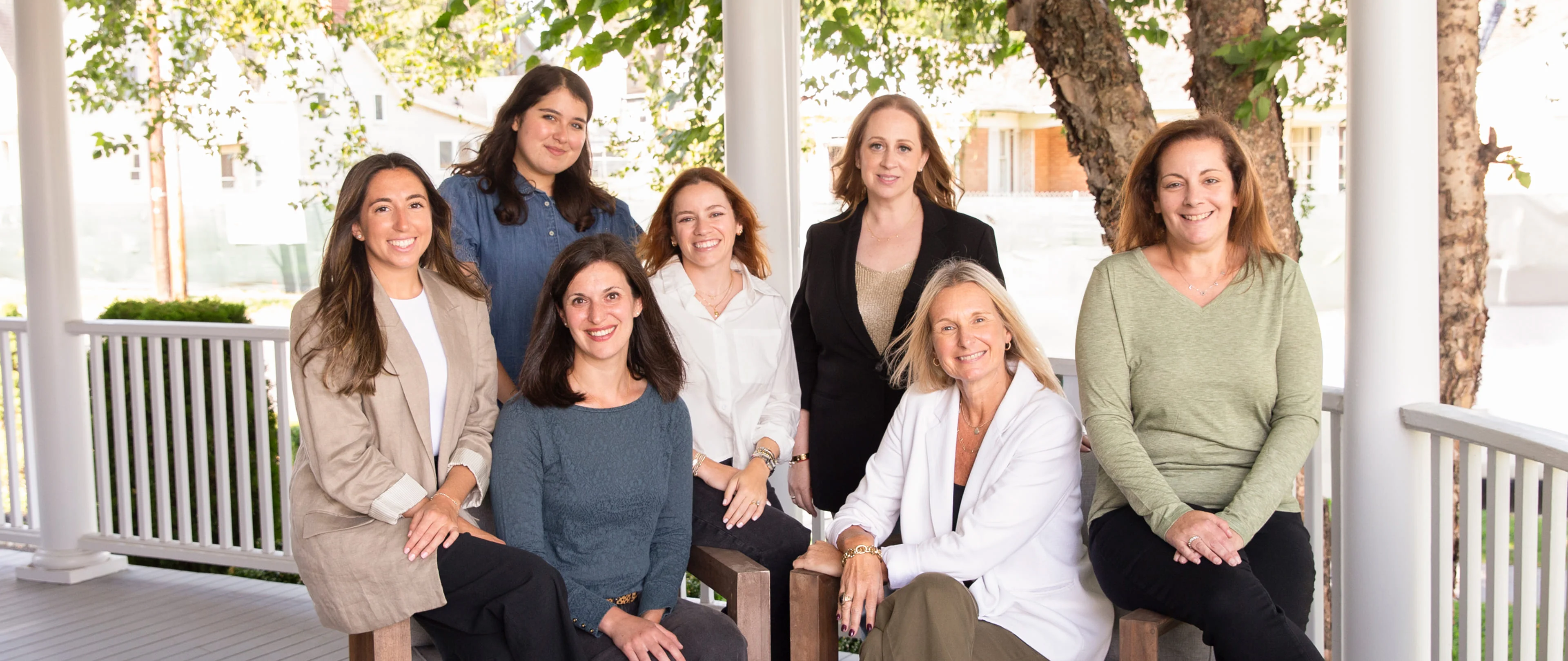 The ZAP Group team photo on a front porch