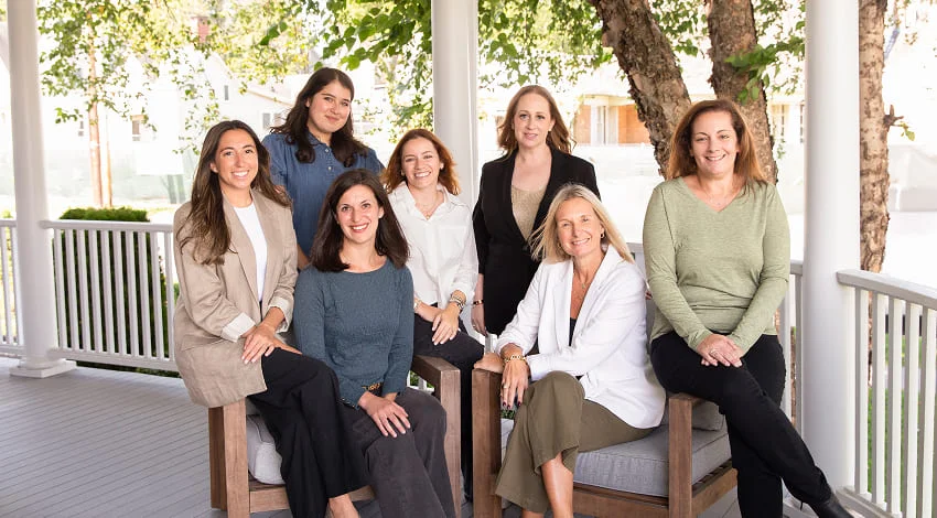 The ZAP Group team photo on a front porch