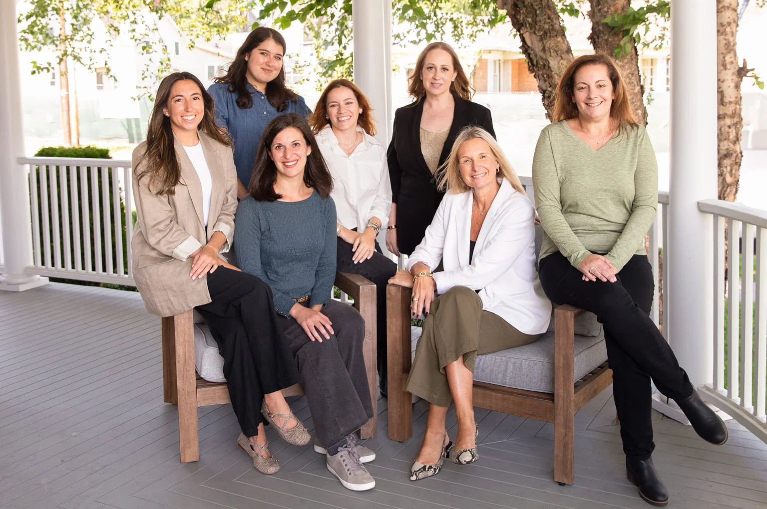 The ZAP Group team photo on a front porch